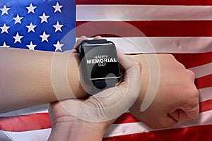 Male hand with smartwatch with text Happy memorial day