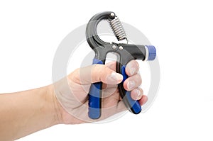 Male hand squeezes an expander for training arm muscles isolated on white background. Carpal expander in male hand close up