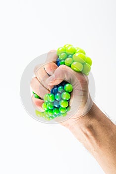 Male hand squeezing stress ball