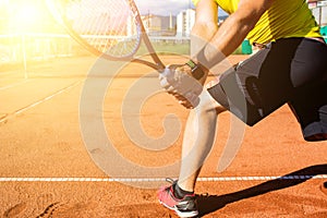 Male hand with tennis racket