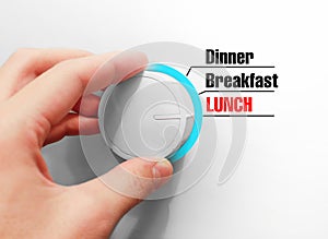 Male hand turns the switch. Switches mealtimes. Chose the Lunch