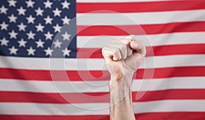 Male hand USA flag. Male fist