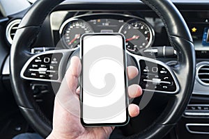 Male hand using smartphone in car. Man driving a car. Smartphone in a car use for Navigate or GPS. Mobile phone with isolated