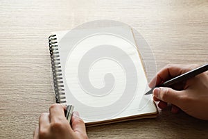 A male hand writing.