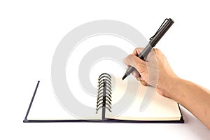 A male hand writing on blank notebook isolated