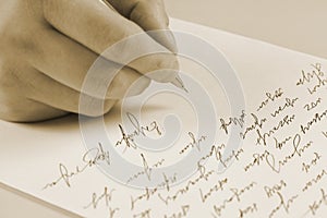 Male hand writing on a paper