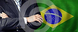 Male hands against Brazilian flag background, business, politics and education in Brazil concept