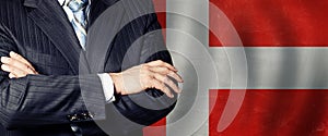 Male hands against Danish flag background, business, politics and education in Denmark concept