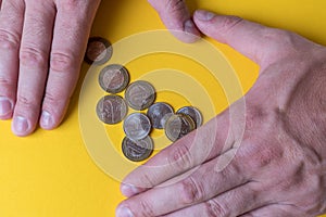 Male hands around coins. Protecting your money. Lack of money. Plan of expenses