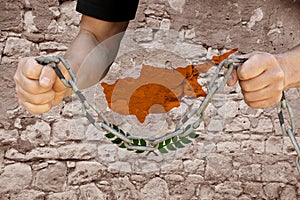 Male hands break the iron chain, a symbol of bondage,protest against the background of the national flag of Cyprus, the concept of