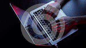 Male hands coding on laptop screen. Fingers programming on computer, development web, developer. Hacker typing on laptop keyboard.