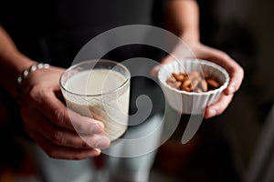 Male hands with glasse of vegan milk