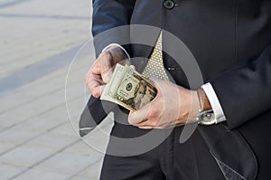 Male hands hold dollars banknotes. business concept. counting profits. money in hand.