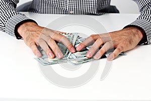 Male hands hold dollars