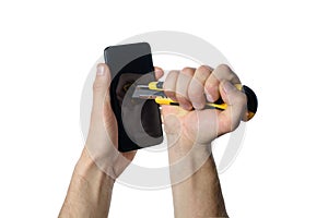 male hands hold phone and make scratches on the screen by stationery knife. crush test for phone glass.