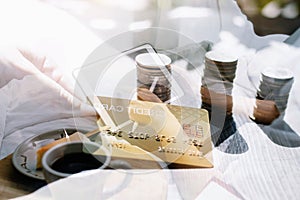 male hands holding a credit card and use mobile phone for Online payment online shopping