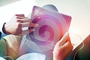 Male hands holding digital tablet