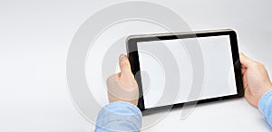 Male hands holding digital tablet blank screen horizontally. Take your screen to put on advertising