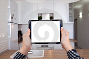 Male hands holding tablet with isolated screen kitchen in house
