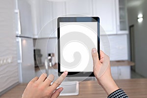 Male hands holding tablet with isolated screen kitchen in house