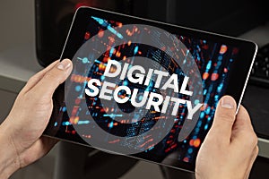 a male hands holding a tablet with the phrase digital security over a technology concept