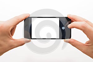 Male hands horizontally holding a smartphone ready to take a picture isolated on white