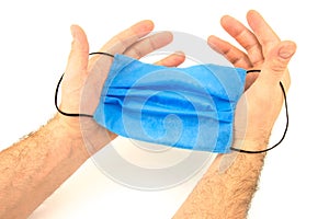 Male hands with hygienic mask