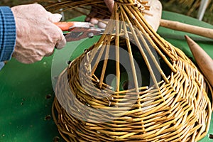 Male hands Manufacturing Wickerwork basket