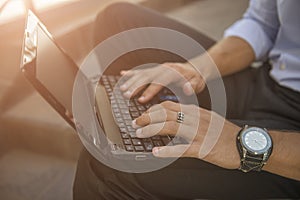 Male hands on notebook keyboard