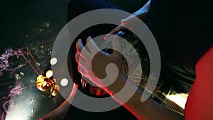 Male hands playing on darbuka, slow rhythm, incense