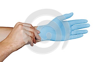 Male hands putting on blue medical gloves isolated on white background