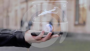 Male hands show on smartphone conceptual HUD hologram small business jet aircraft