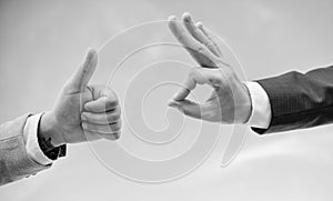 Male hands show thumbs up sign. Success and approval concept. Gesture expresses approval. Business approval and