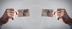 Male hands showing Plan A and Plan B. Business concept