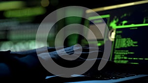 Male hands typing computer code, security program for database or servers