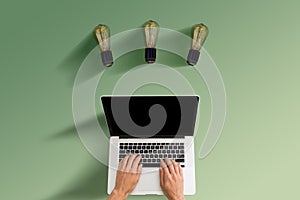 male hands typing on a laptop keyboard in the office