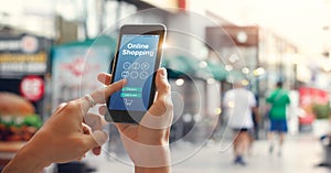 Male hands using smartphone for online shopping on street in city