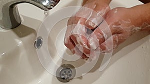 male hands wash with soap, slow motion