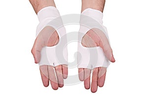 On male hands white cloth gloves for karate or kick boxing, isolated on white background isolated