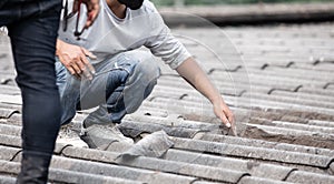 Male handyman repairing the roof