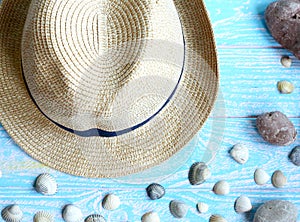 Male hat close-up, sea shells, sea stones Summer vacation concept