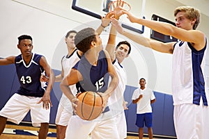 Male High School Basketball Team Playing Game