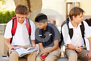 Male High School Students Hanging Out On School Campus