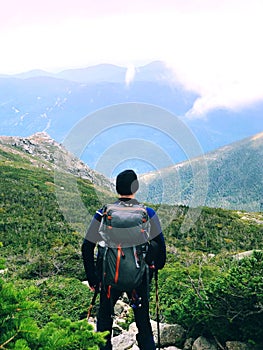 A male hiker hiking on Lion Head trail on Mt. Washington