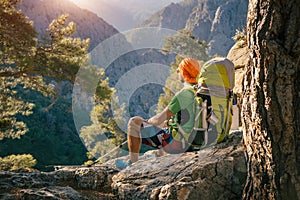 Male hiker taking a moment to watch sunset