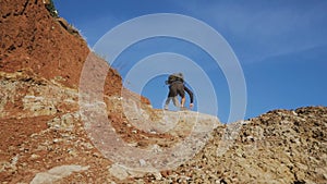 Male hiker walks in mountains