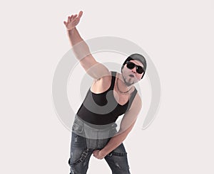 Male hip-hop dancer posing in the Studio. Isolated on white background .