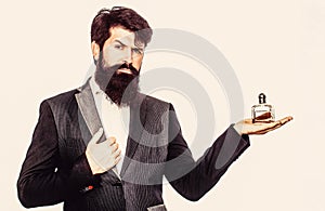 Male holding up bottle of perfume. Man perfume, fragrance. Perfume or cologne bottle and perfumery, cosmetics, scent