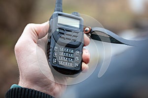 Male holding walkie talkie