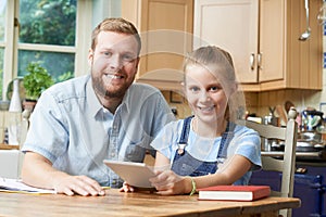 Male Home Tutor Helping Girl With Studies photo